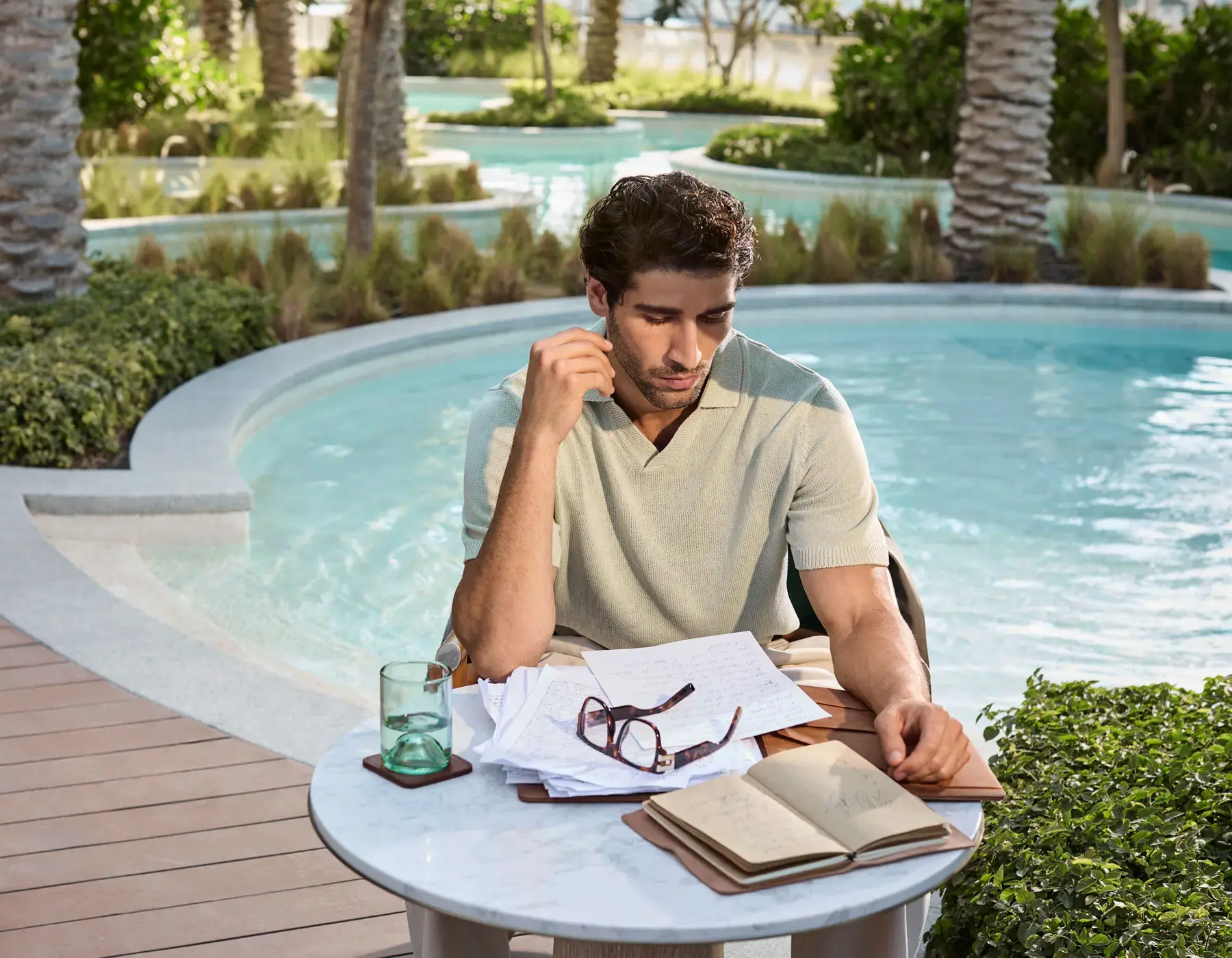 Vida Residences poolside deck and lagoon pool — brand amenity photography, indicative for the Al Reem Island, Abu Dhabi address